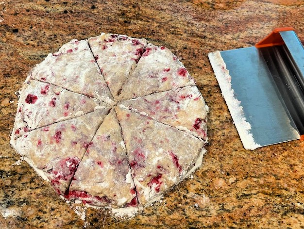 sourdough scones on counter with dough scraper