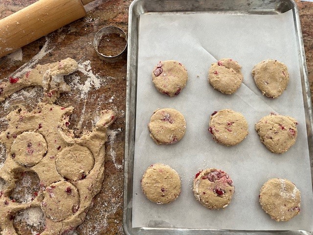 scones on baking tray with rolling pin and cutter