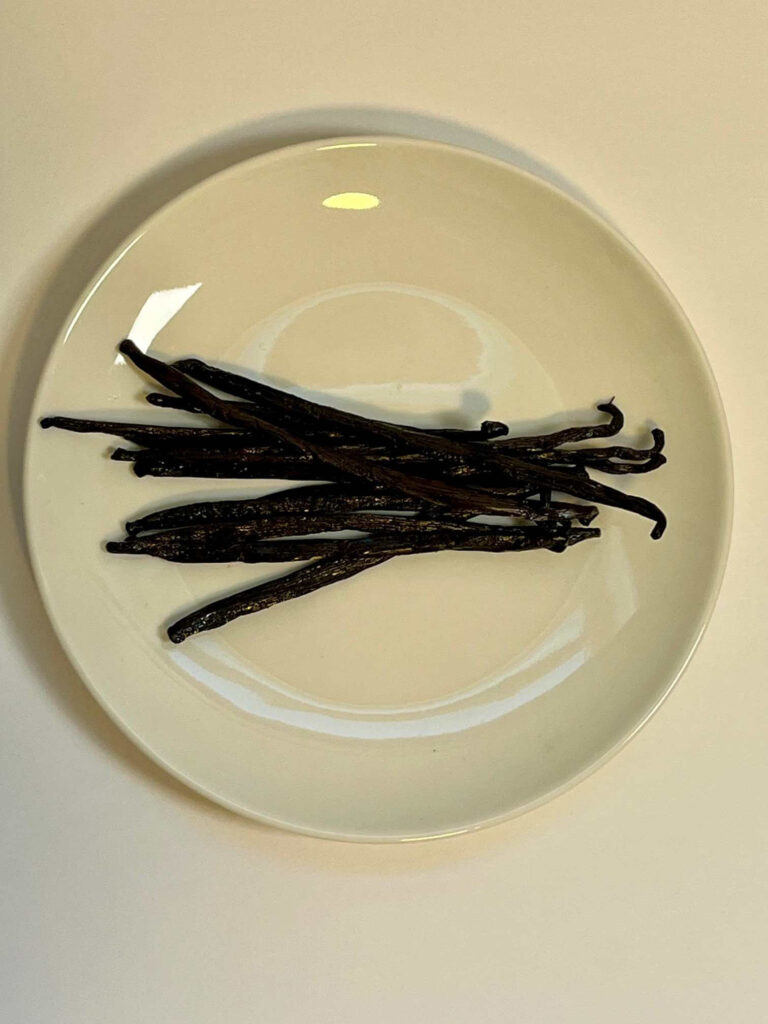 vanilla beans on a white plate