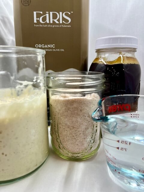 all the ingredients on white background for making fresh milled flour pizza crust