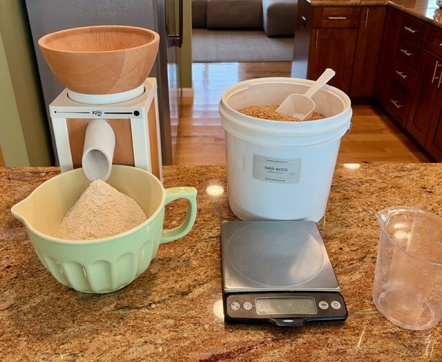 Grain Mill, Bowl, Bucket of wheat berries, scale for making freshly ground wheat