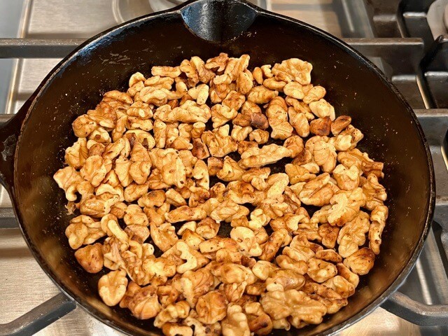 Nuts toasted in cast iron pan for freshly milled chocolate chip cookies
