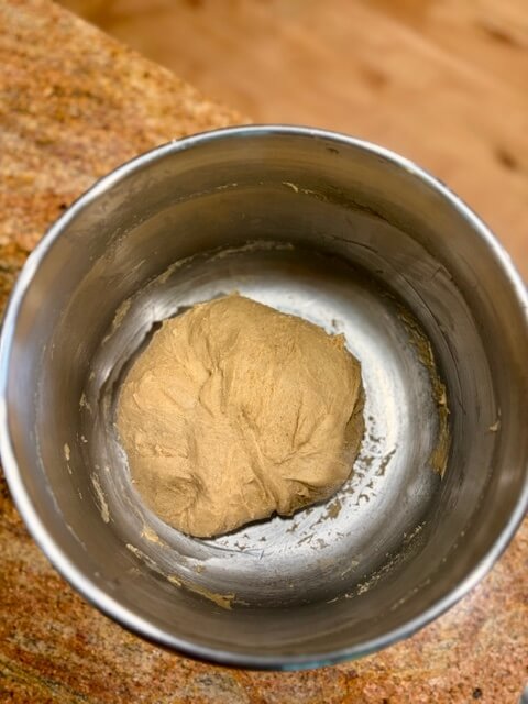 Dough before it rises in the mixing bowl
