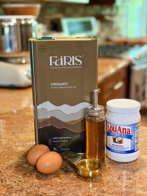 Eggs, oil, vanilla, on a countertop