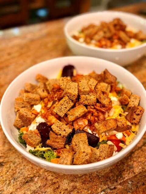 Fresh Milled FLour Focaccia Croutons on top of a salad