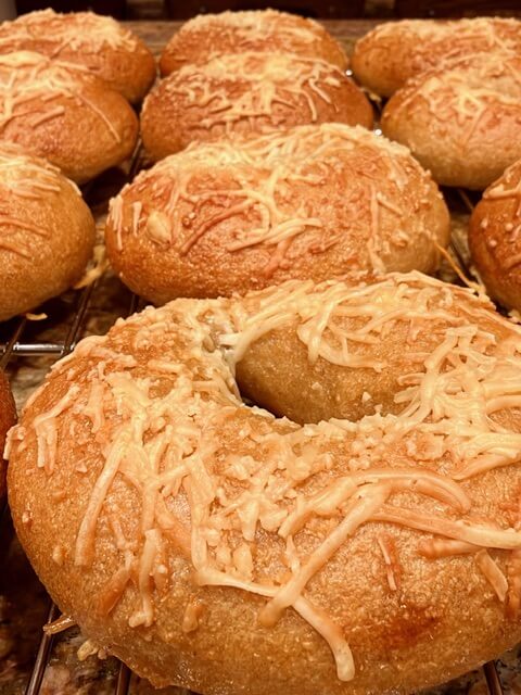 fresh milled flour bagels sitting on a cooling rack