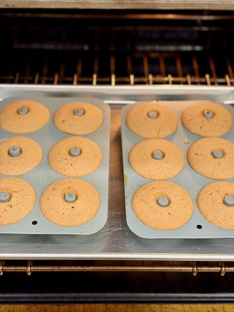 fresh milled flour apple cider donuts being baked in the oven on the rack